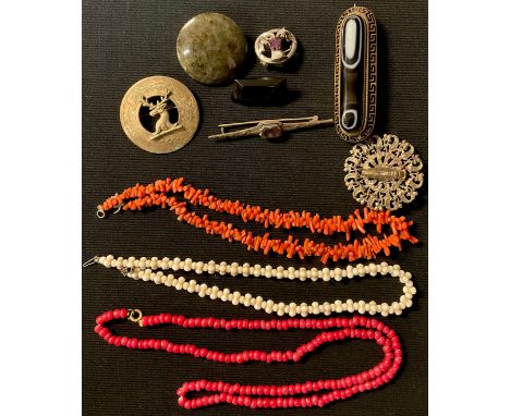 A 19th century Etruscan revival oval agate brooch, black enamel Greek key border, 8cm; a coral necklace; a red glass bead nec