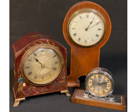An Art Deco eight-day clock; a lacquer cased mantel clock; an Arts and Crafts mantel clock (3) 