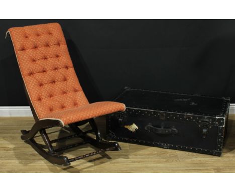 A mahogany folding steamer rocking chair, 95cm high, 52.5cm wide, the seat 41cm deep; a steamer trunk, 31.5cm high, 96cm wide