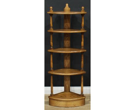 An Ercol elm five tier corner whatnot, 125.5cm high, 46.5cm wide, 32cm deep 