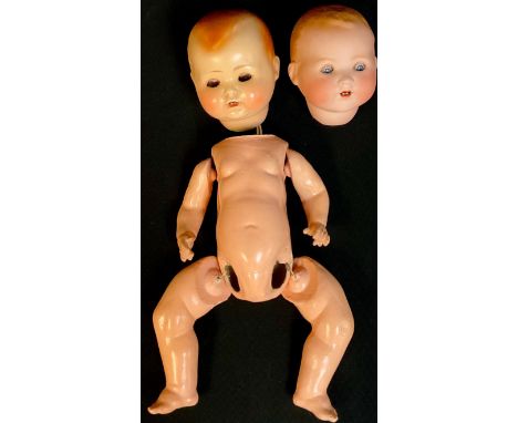 An Armand Marseille bisque baby doll head, 351/6.K; a composite baby doll head and body parts 
