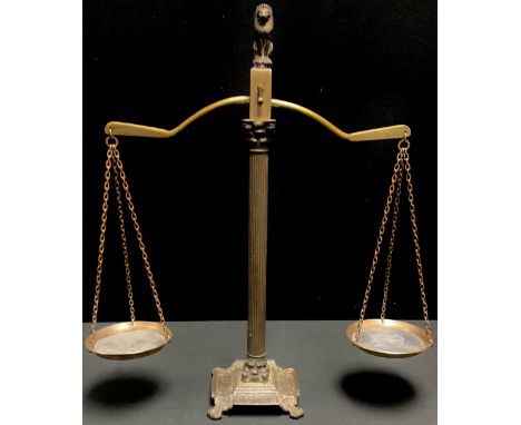 A set of 19th century brass balance scales, lion finial, 52cm high 