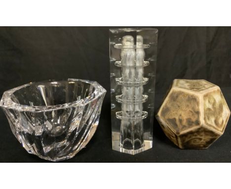 An Orrefors Sweden glass bowl, 8cm high; an art glass candlestick; a studio pottery dodecahedron (3) 