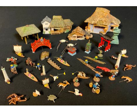 A 1950s Japanese miniature model garden, comprising cold painted spelter pagoda, bridge, shelter and boat with earthenware bu