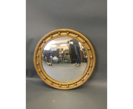 A convex gilt framed wall mirror, 25" diameter (restored) 