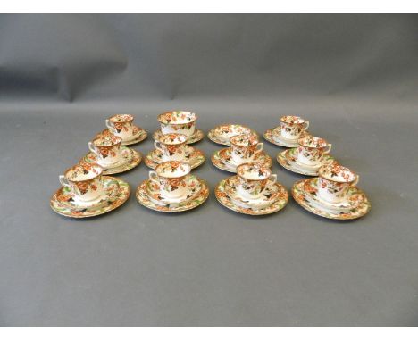 A late C19th/early C20th Windsor twelve piece tea service with gilt ribbed rims and floral decoration, cake plate 7" diameter