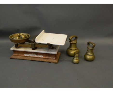 A set of brass scales with brass dump weights, early C20th, 22" long 