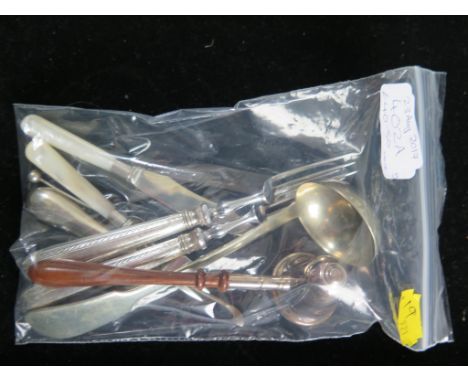 A miscellaneous collection of silver to include a child's silver and mother of pearl knife and fork, etc