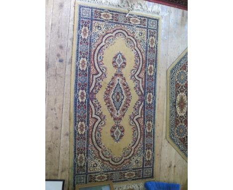 A Louis de Poortere 'Mossoul' carpet, with red field 304cm x 202cm,  a similar rug, 150cm x 66cm and two 'Keshan' style rugs 