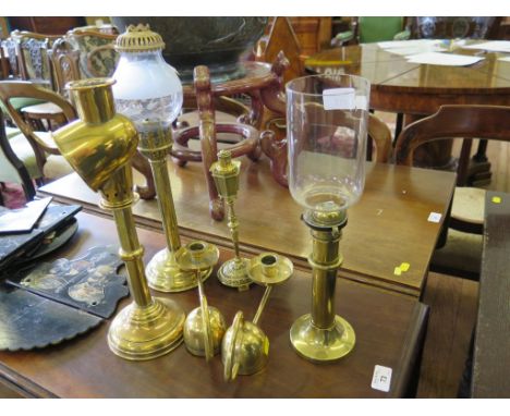 A pair of early 20th century brass chambersticks, with domed weights, stamped with cross sword mark, a table lighter in the f