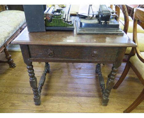 An oak bobbin turned side table, parts possibly 18th century, with rectangular top, frieze drawer and bobbin turned side stre