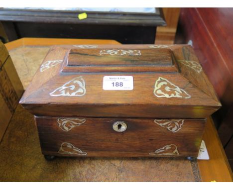 An early Victorian rosewood and mother of pearl inlaid sarcophagus form tea caddy 25cm wide