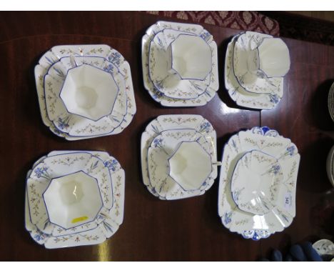 A Shelley part tea service, with blue orchid pattern, for five place settings, and bread plate