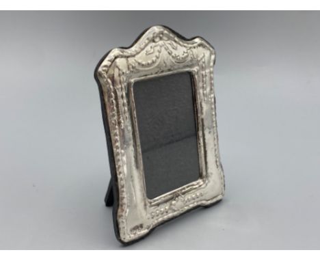 A silver easel back picture frame