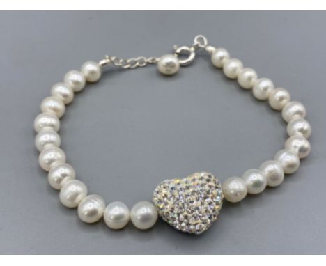 A silver freshwater pearl bracelet with heart shaped cabochon set with cz