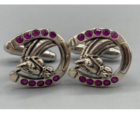 A pair of silver and ruby set horseshoe shaped cufflinks, 10.7g