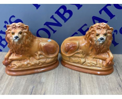 Pair of vintage Staffordshire lions with glass eyes