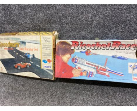 2 vintage racing games to include Battery operated “Speedmarx” auto racing set together with Ricochet Racers by Palitoy, both