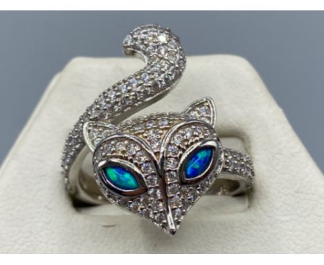 A silver and cz ring in the form of a fox with opal eyes, 5.2g size P