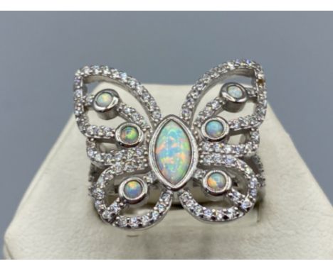 A silver cz and opal panelled dress ring in the form of a butterfly, 6.2g size T