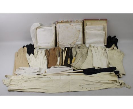 A quantity of lady's vintage gloves including full length kid gloves, driving gloves and coloured leather and evening gloves,