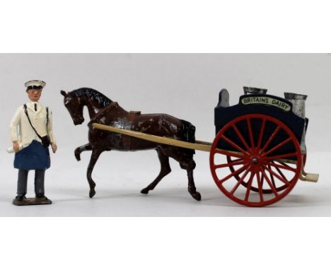 A Britains Horse Drawn Milk Float No 131F, a Tumbrel Cart, No 4F, with hay ladders and figure, and a Crescent Toys Tractor No