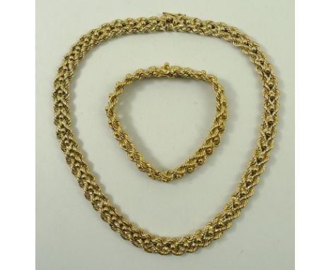A 9ct gold rope twist neck chain and bracelet, on a snap clasp, for Carrington & Co, 110.3g, boxed.