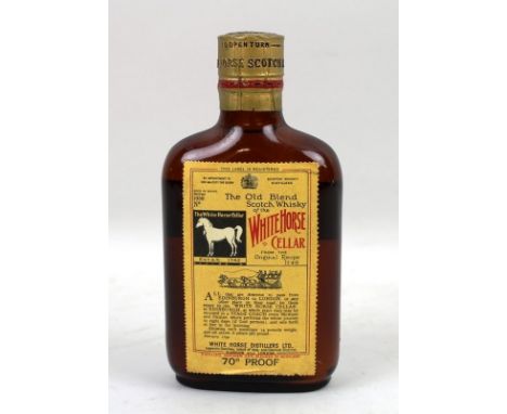Whisky: a bottle of The Old Blend Scotch Whisky of the White Horse Cellar, aged in wood, bottled 1958, foil capsule, twist ca