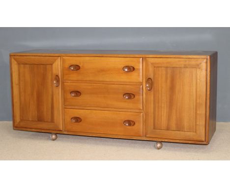 A Ercol 1960's blond elm sideboard, 156 by 44 by 69cm high