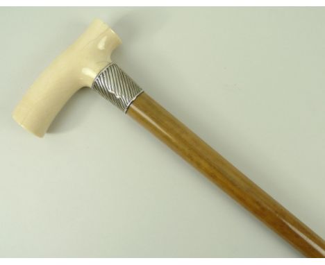 A Victorian malacca walking stick with an ivory handle and spiral fluted ferrule with shield reserve, London 1888, 96.5cm lon