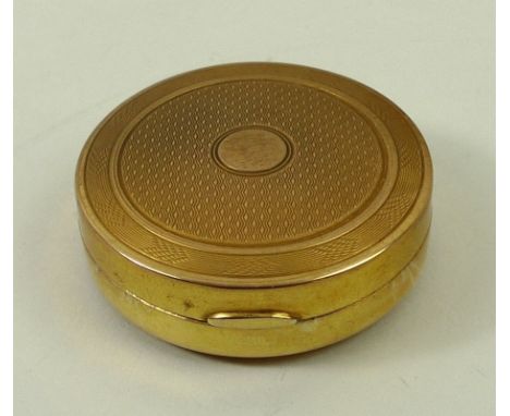 A 9ct gold circular compact with engine turned decoration, Birmingham 1928, 36.4g, cased.