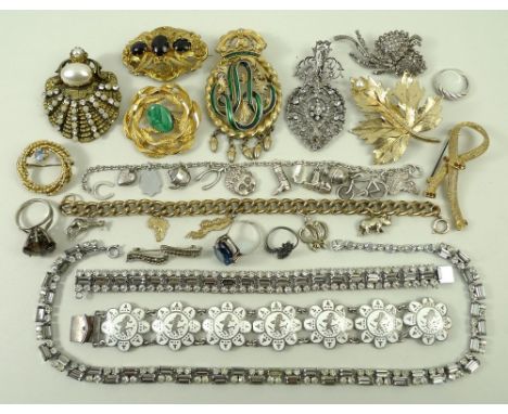 A quantity of silver and costume jewellery including a Victorian paste set pendant, marcasite brooch, gilt and green enamel c