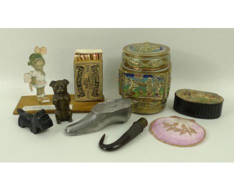 A quantity of vertu, comprising a seated dog vesta case, Black Forest dog pencil sharpener, shoe form vesta case, novelty mat