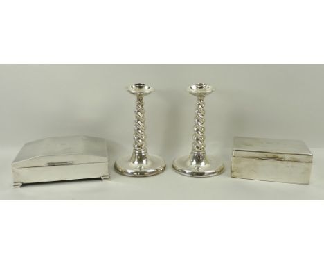 A pair of loaded silver candlesticks raised on spiral twist stems, Birmingham 1927, 17cm high, cigarette box with engine turn