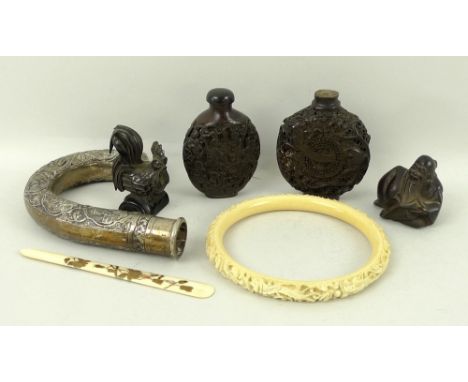 A 19th century Chinese ivory bangle, carved with two dragons, 10cm, a Canton export white metal walking cane handle, a Japane