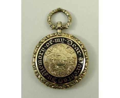A Victorian gold and black enamel mourning pendant, obverse floriate engraved with central reserve, monogram engraved, within