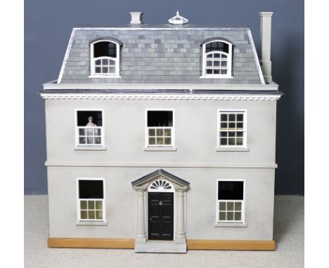 A bespoke, craftsman made dolls house modelled as a three story Georgian town house with a mansard roof and sash windows, ope