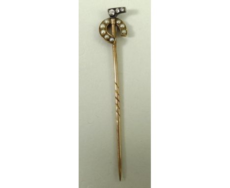 A gold stick pin formed as a polo stick and horseshoe set with seed pearls and old cut diamonds, 1.6g, boxed.