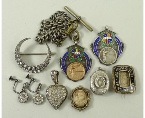 A Victorian gilt and black enamel 'In Memory Of' mourning brooch, two silver and enamel shooting medals, paste set silver cre