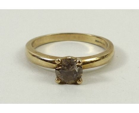 A 9ct gold and cinnamon diamond solitaire ring, approximately 0.75ct, size R, 2.8g.