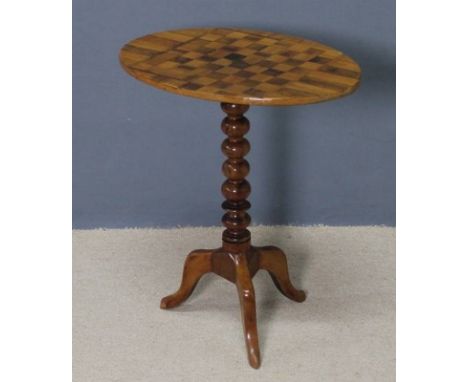 A Victorian mahogany tripod table, the top inlaid with a chessboard of rosewood and satin wood, with star to the centre, rais