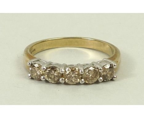 A 9ct gold and diamond five stone ring, approximately 0.6ct, size R, 3.3g.