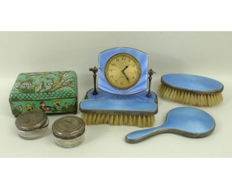 A silver and turquoise guilloche enamel travelling dressing table set, comprising clock, hand mirror, clothes brush and hair 