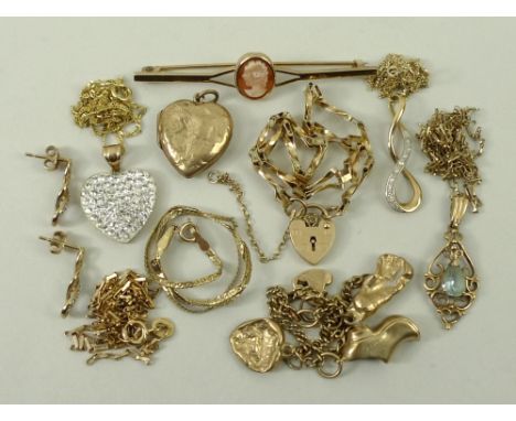 A quantity of 9ct gold jewellery including a an aquamarine set pendant on chain, baby's charm bracelet, two heart shaped pend