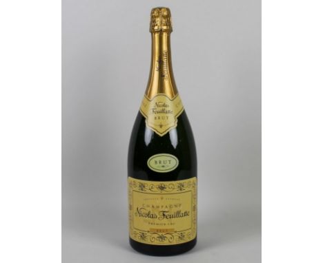 Vintage Champagne: a magnum of Nicolas Feuillatte Champagne, Brut, Premier Cru, circa 1990, U: 1cm inverted.