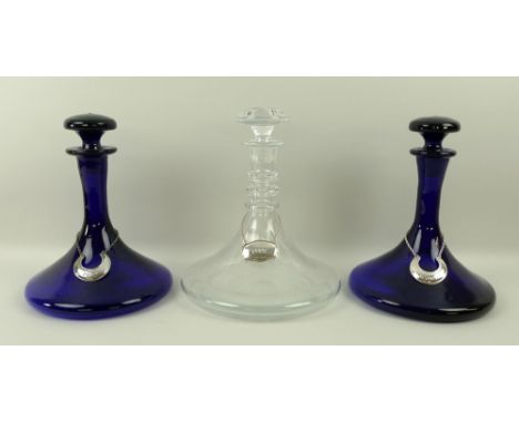 A pair of Bristol style blue glass ship's decanters and stoppers, 24cm high, cut glass three ring ship's decanter etched with