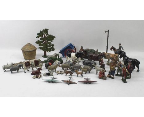 A collection of Britain's farmyard animals, farmer, a tree, gate, haystack, troughs and sundry lead figures. 
