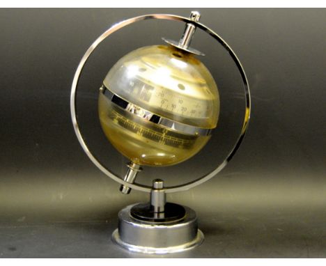 A mid 20th Century chromed globe thermometer and barometer combination made in Western Germany