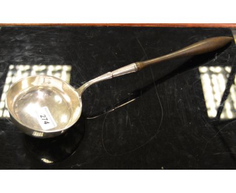 A large 19th century silver coloured metal ladle, turned handle