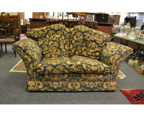 A contemporary sofa in tones of gold and blue